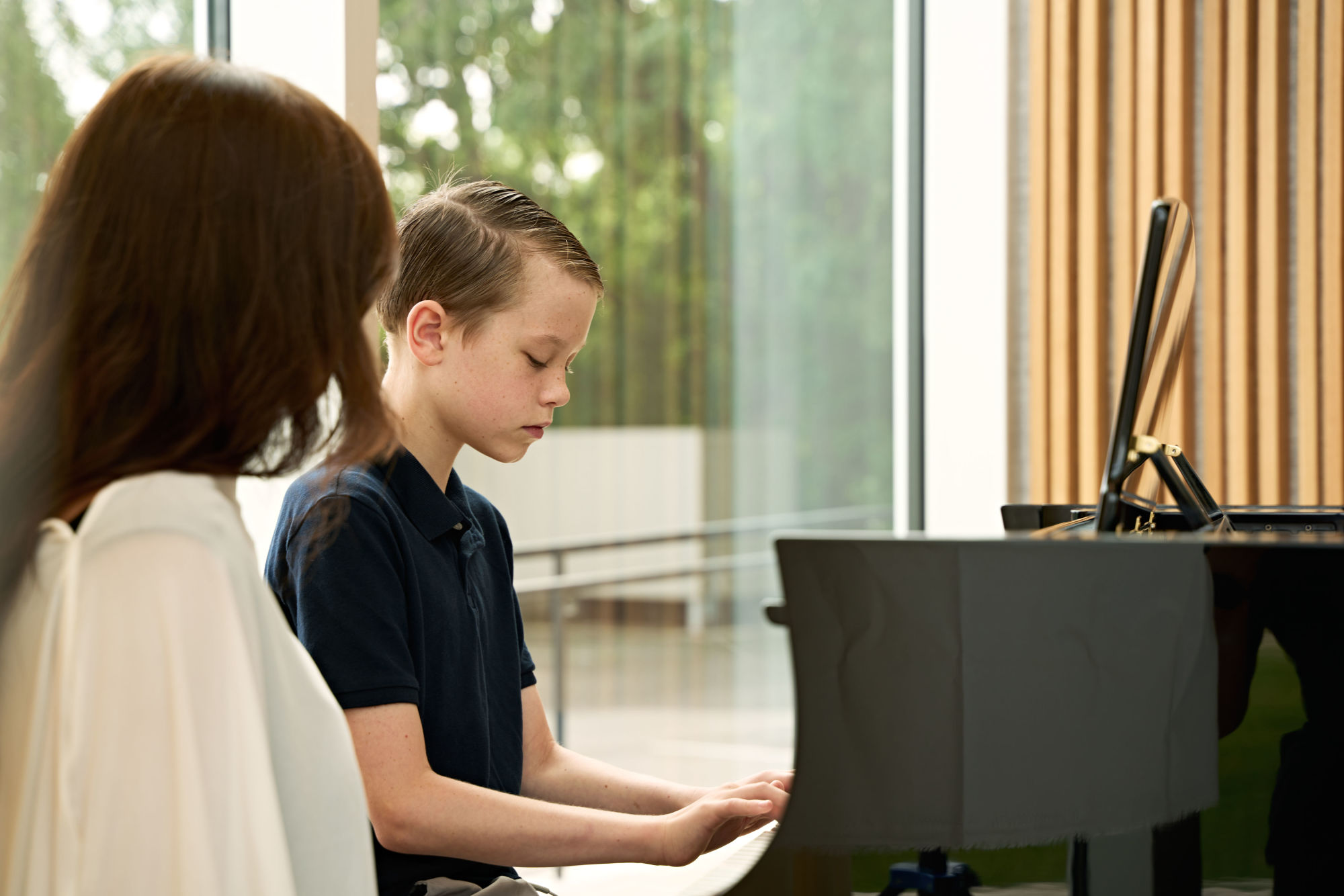 Student at a piano lesson